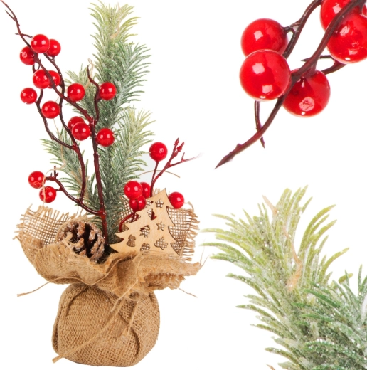Christmas table decoration made of jute with red berries and a pine cone