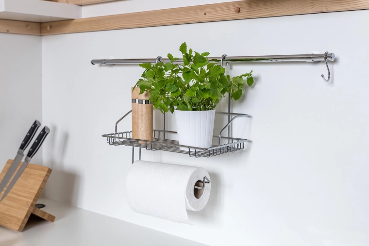 Integrated holder for towels and rolls