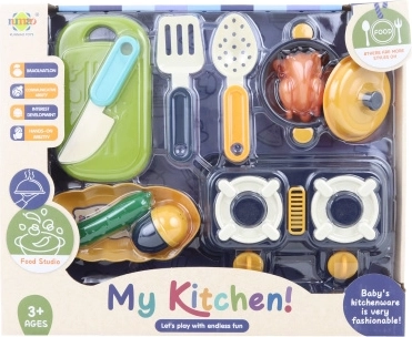Children’s plastic kitchen set with a stove and play food replicas