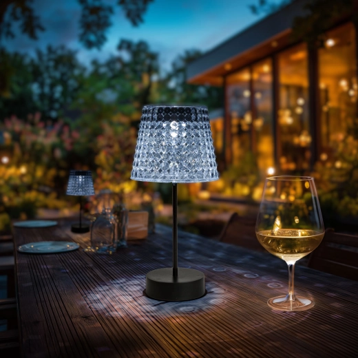Beschadigde solar tafellamp met transparante kap en koudwit led