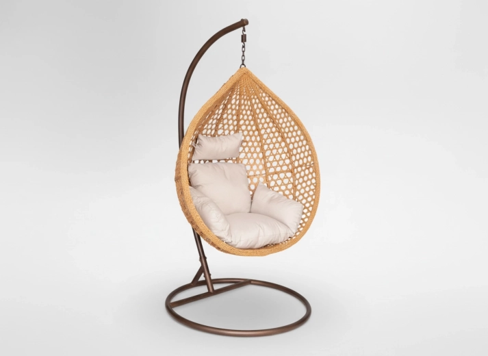 Hanging egg chair with beige cushion, brown stand