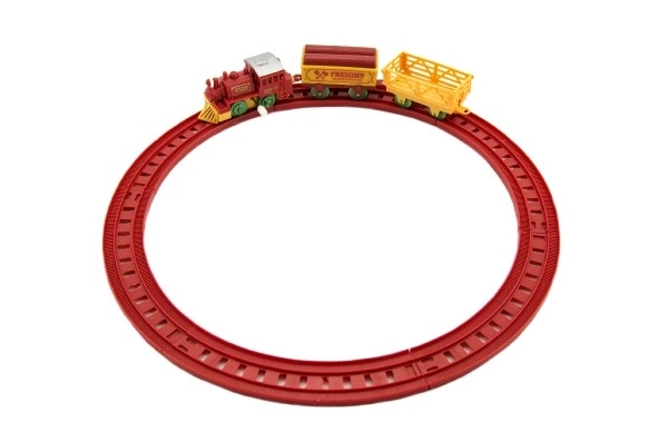 Trein met sleutel en twee wagons en sporen