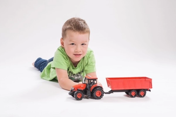 Rode Zetor tractor met aanhanger met geluidseffecten en lichteffecten - 36 cm