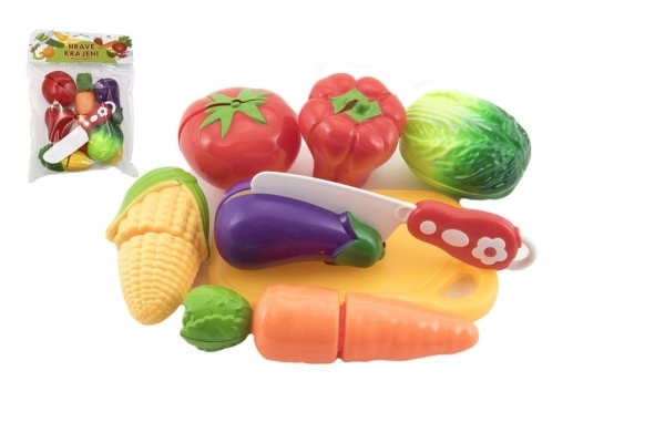 Légumes à découper en plastique avec planche 13,5x8cm avec couteau dans sac 18x26x5cm