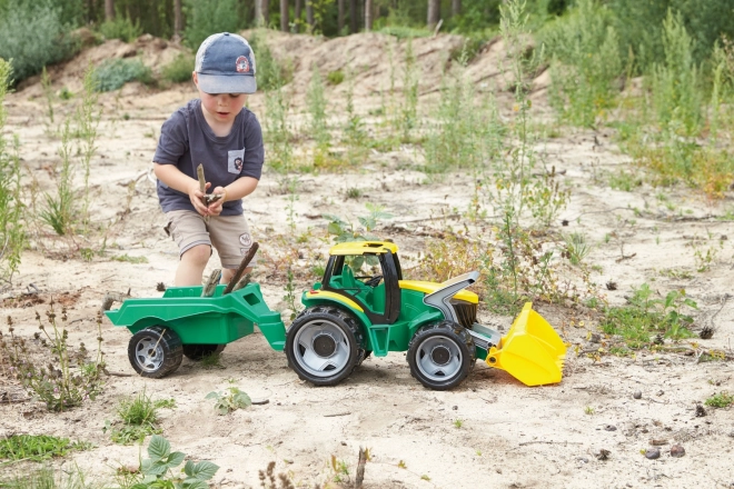 Traktor mit Schaufel und Anhänger