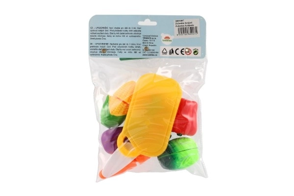 Légumes à découper en plastique avec planche 13,5x8cm avec couteau dans sac 18x26x5cm
