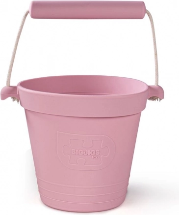 Seau de plage en silicone rose pâle BIGJIGS TOYS