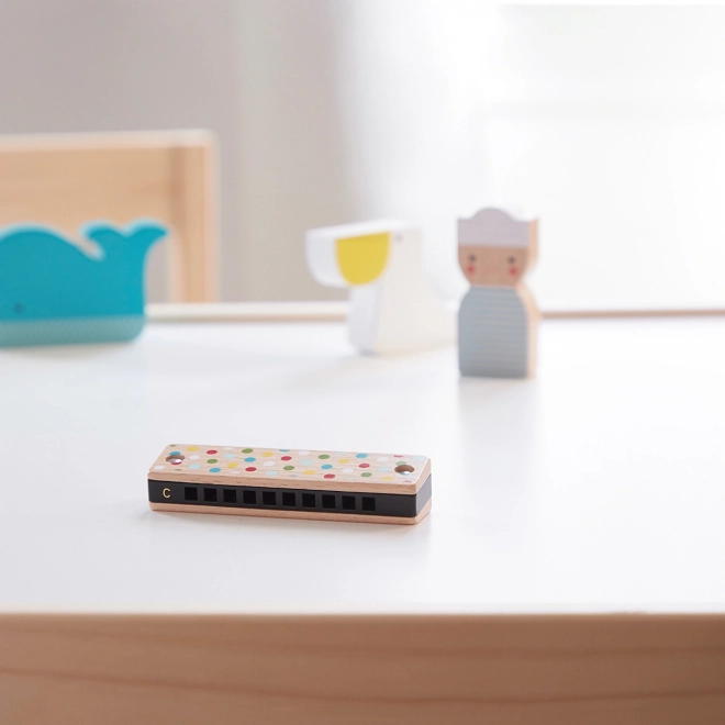 Wooden harmonica with stripes and dots