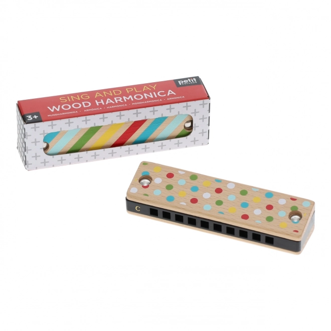Wooden harmonica with stripes and dots