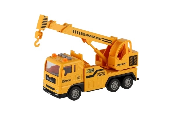 Auto kraan kunststof 16cm op frictie met batterijen met licht en geluid in doos 21x13x9cm