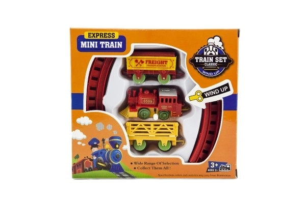 Trein met sleutel en twee wagons en sporen