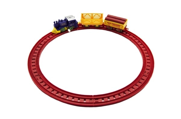 Trein met sleutel en twee wagons en sporen