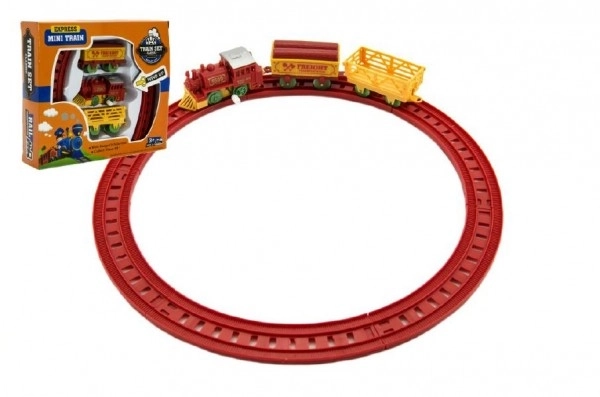 Trein met sleutel en twee wagons en sporen