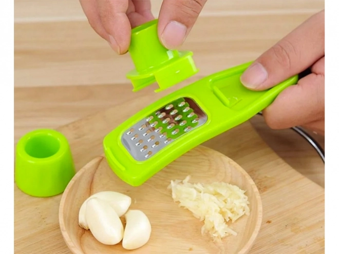 Mini-rasp voor knoflook en gember met veiligheidshouder – groen