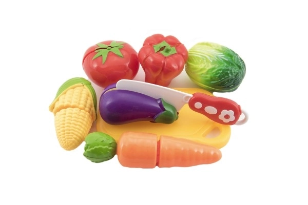 Légumes à découper en plastique avec planche 13,5x8cm avec couteau dans sac 18x26x5cm