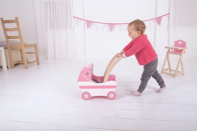 Houten roze poppenwagen