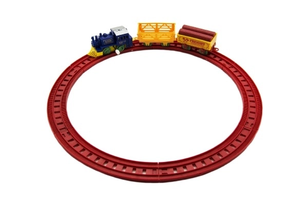 Trein met sleutel en twee wagons en sporen