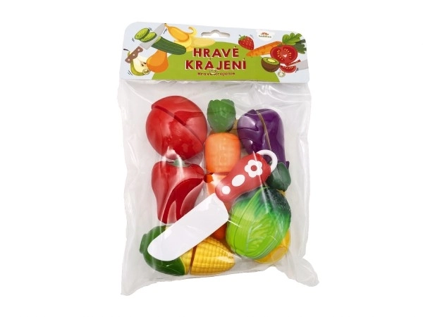 Légumes à découper en plastique avec planche 13,5x8cm avec couteau dans sac 18x26x5cm