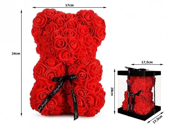 Ourson en pétales de roses dans une boîte cadeau