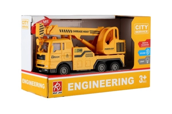 Auto kraan kunststof 16cm op frictie met batterijen met licht en geluid in doos 21x13x9cm