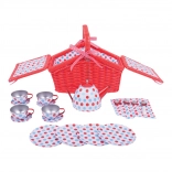 Tea set with polka dot pattern in picnic basket