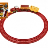 Uhrwerkzug mit zwei Wagen und Gleisen